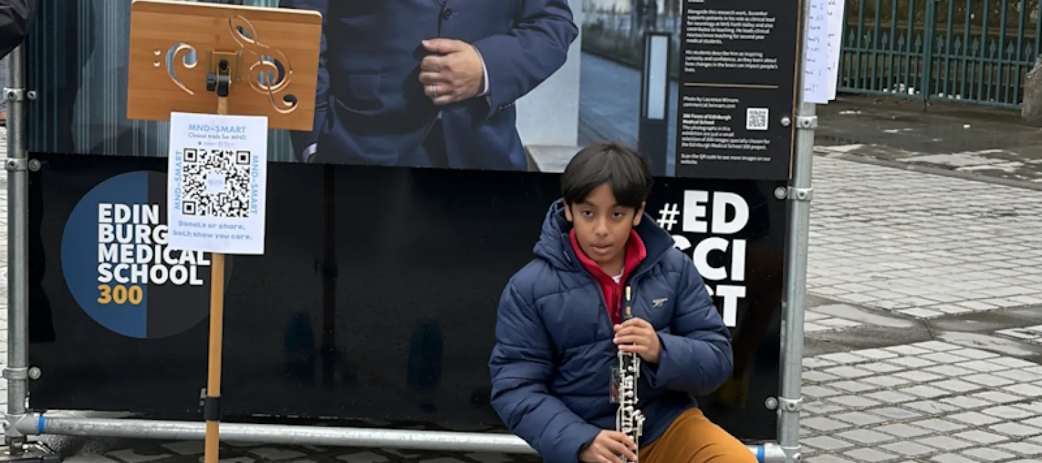 A boy playing his oboe