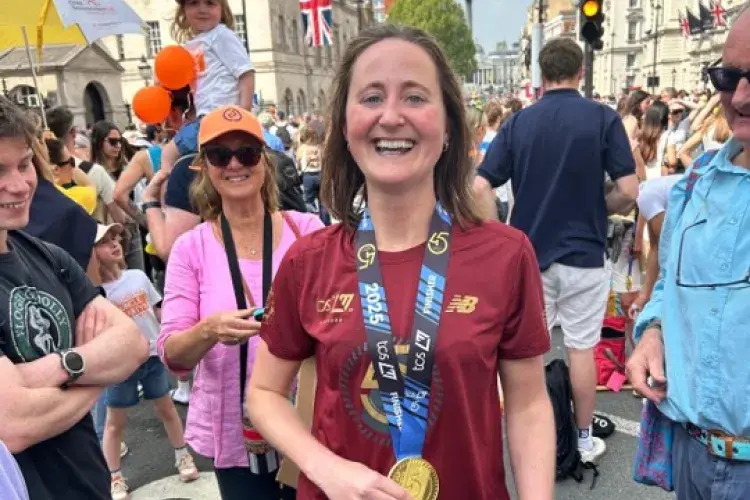 Lucy completing the marathon