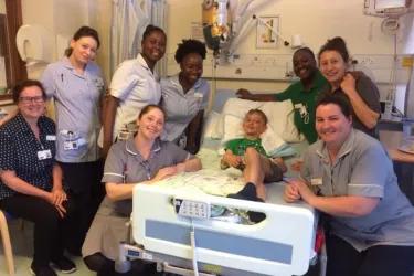 Mandy (far left) with son Matthew (centre) and support team