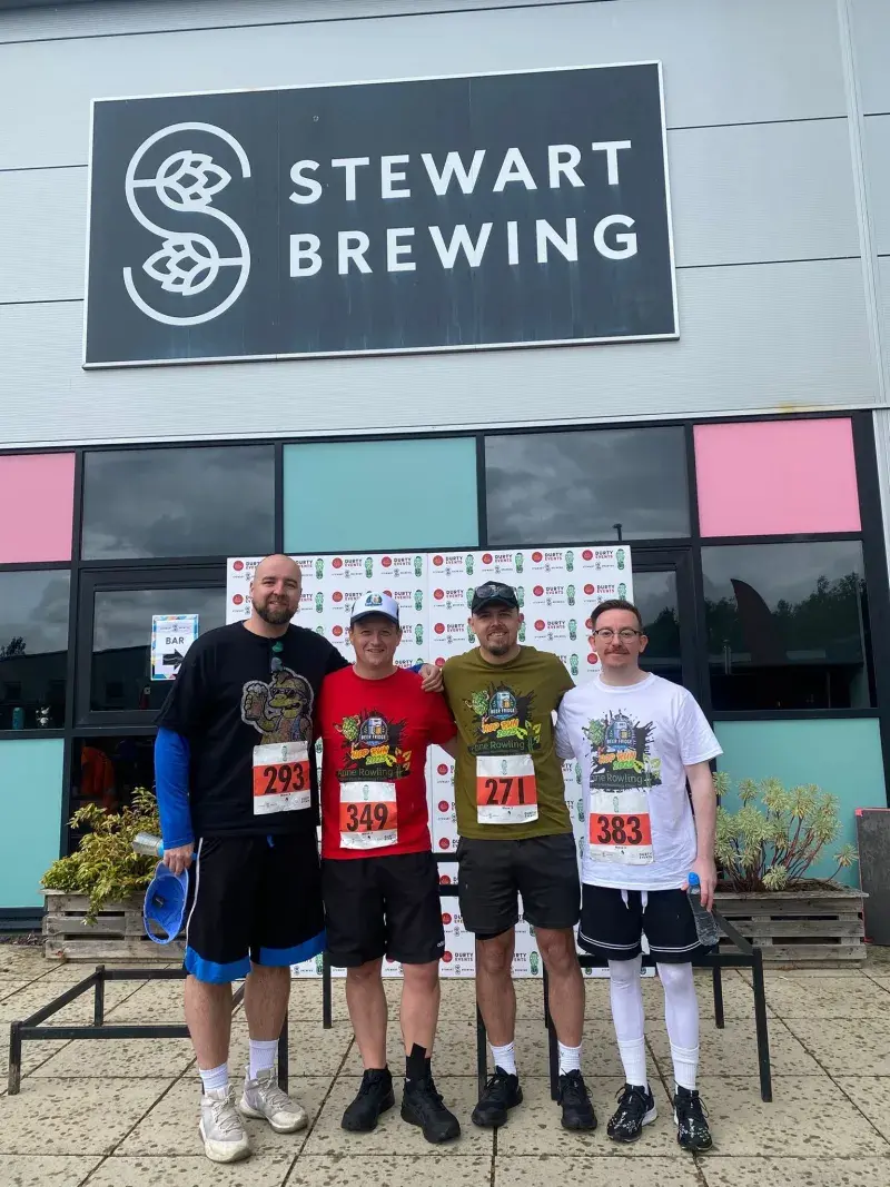 Callum (pictured in red t shirt) with Fundraising Team